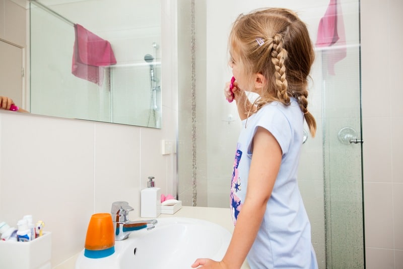 Child brushing teeth